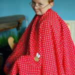 Hairdressing apron with appliqued insects