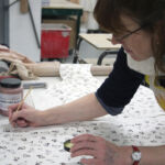 Hand-colouring screen printed slip transfers